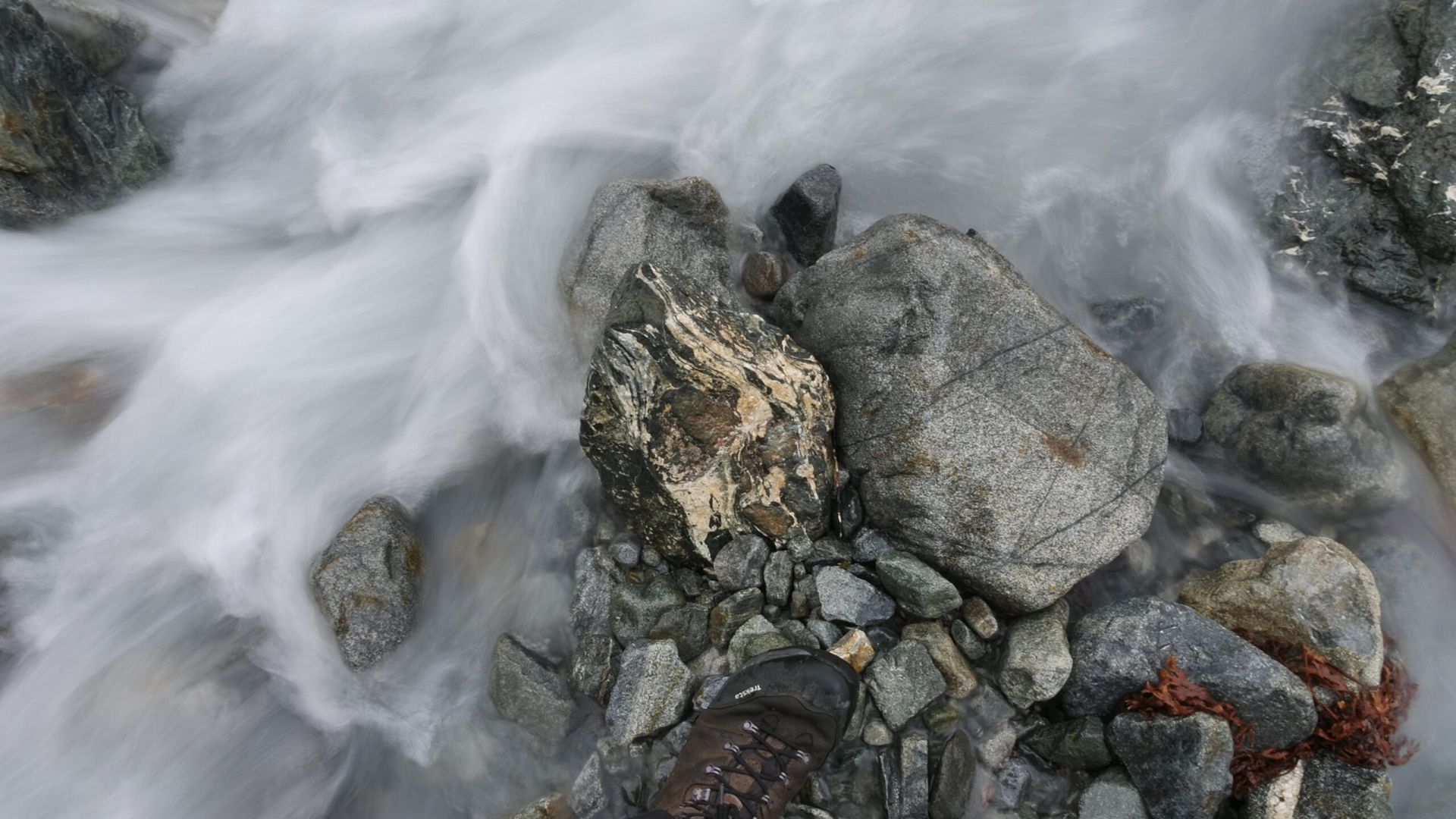 river flowing around a stone